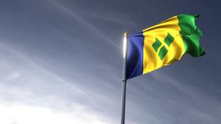 Saint-Vincent-and-the-Grenadines National Flag, The national flag and flagpole looking up against a dark blue sky