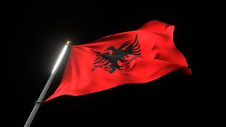 Albania National Flag, A fluttering national flag and flagpole viewed from below on a black background