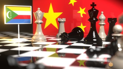 Comoros National Flag, The national flag on a chessboard with the Chinese flag in the background