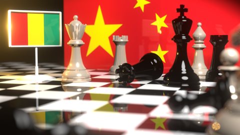 Guinea National Flag, The national flag on a chessboard with the Chinese flag in the background