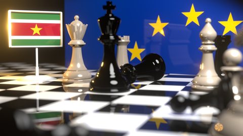 Suriname National Flag, Flags placed on a chessboard with the EU flag in the background