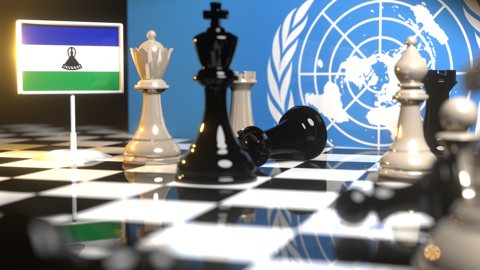 Lesotho National Flag, Flags placed on a chessboard with the UN flag in the background